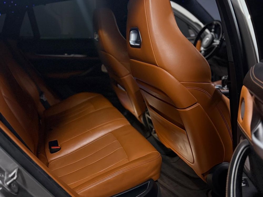 Tan leather interior after a full interior detail